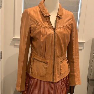 Leather jacket with fabric sleeves